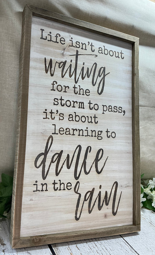 Life isn’t about waiting for the storm to pass sign