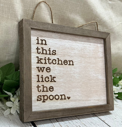 In This Kitchen We Lick The Spoon Sign