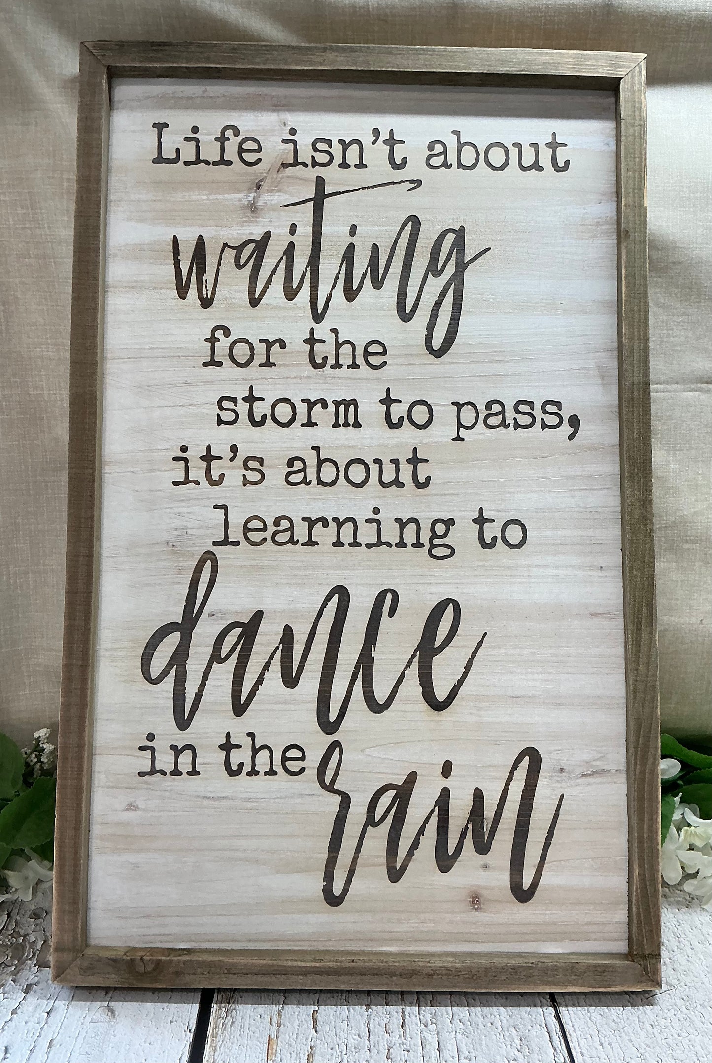 Life isn’t about waiting for the storm to pass sign