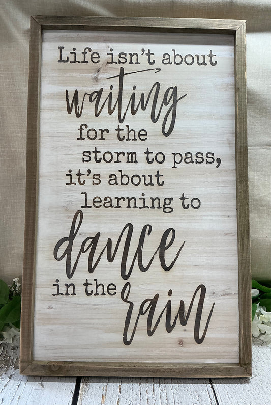 Life isn’t about waiting for the storm to pass sign